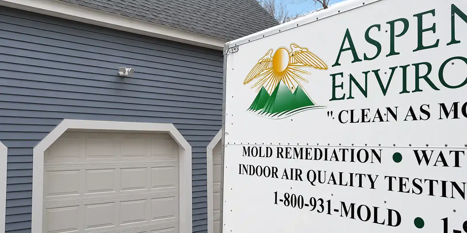 Aspen Environmental trailer parked outside a home